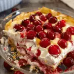 A rich and creamy No-Bake Cherry Cheesecake Lasagna with layers of cheesecake filling, graham cracker crust, cherry topping, and whipped cream.